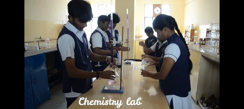 Students running an experiment in the chemistry lab