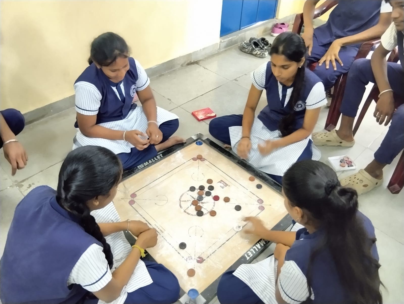 Students playing carrom
