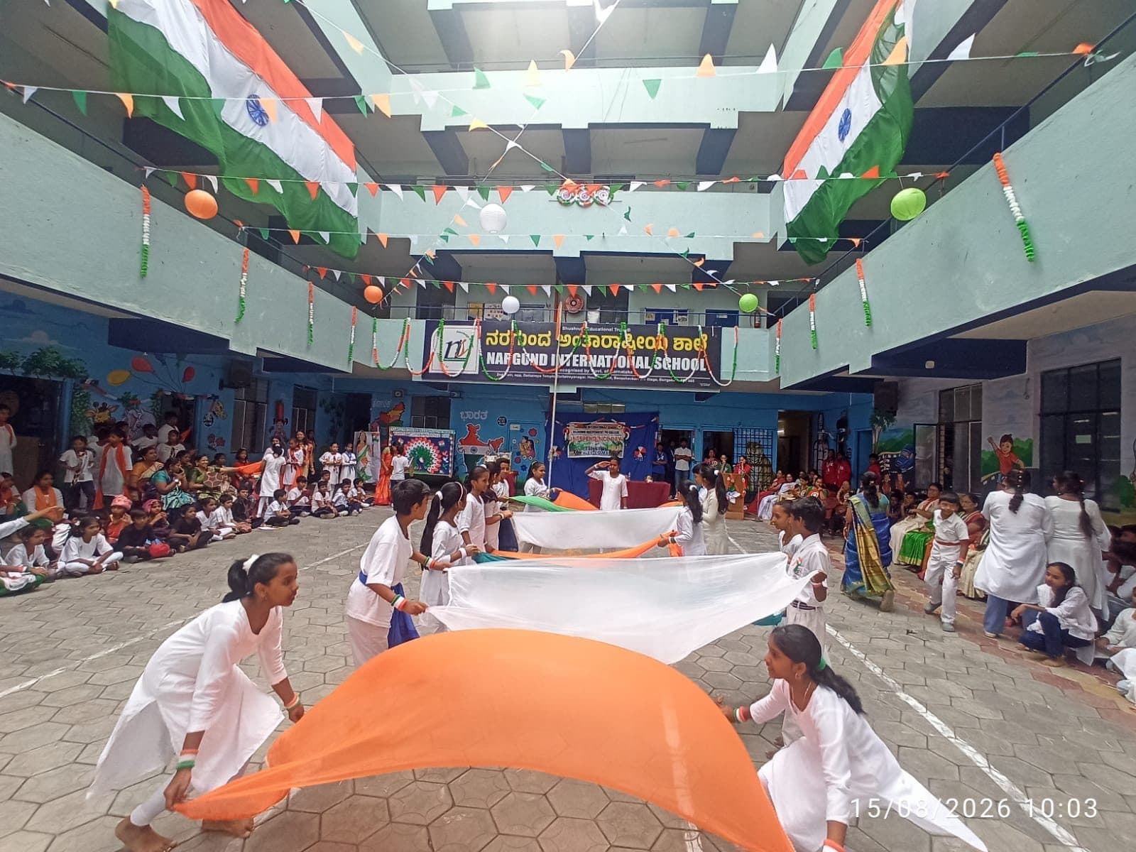 Tricolour performance by students in white