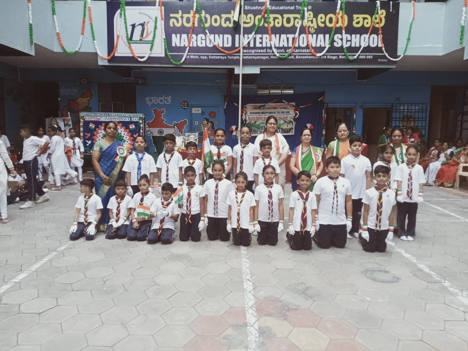 Students with flags at the Independence Day celebration