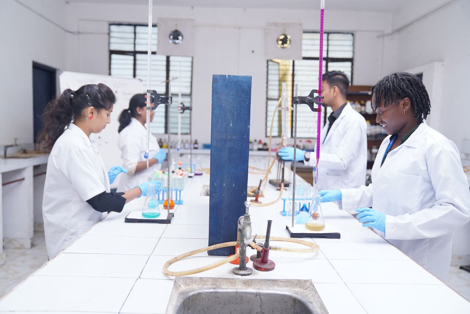Students running an experiment in the chemistry lab