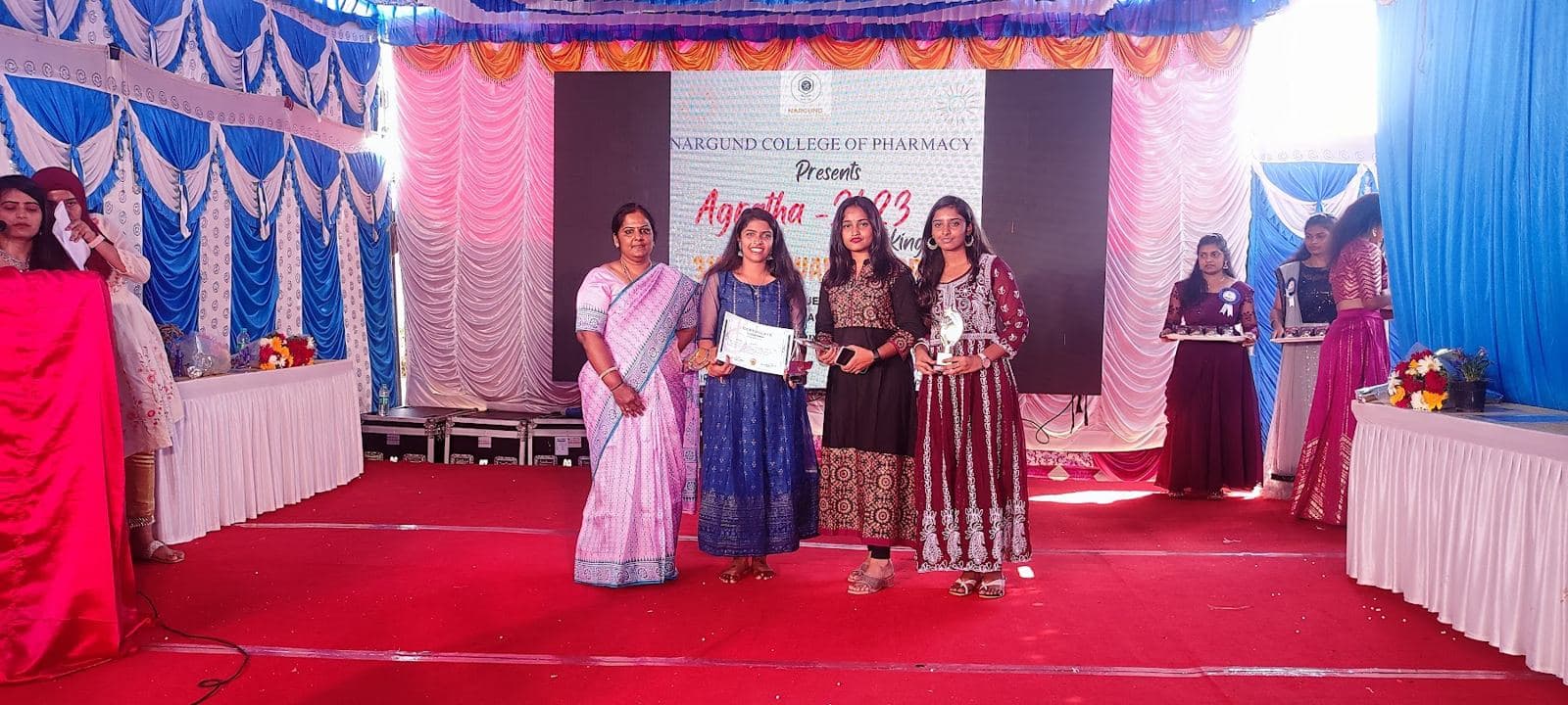 Students receiving prizes at the annual day