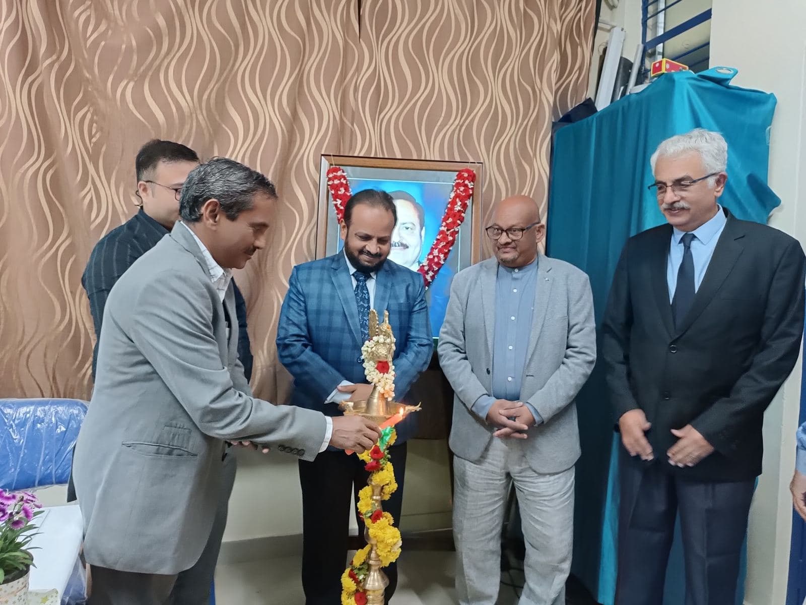 Guests lighting the lamp to inaugurate a seminar