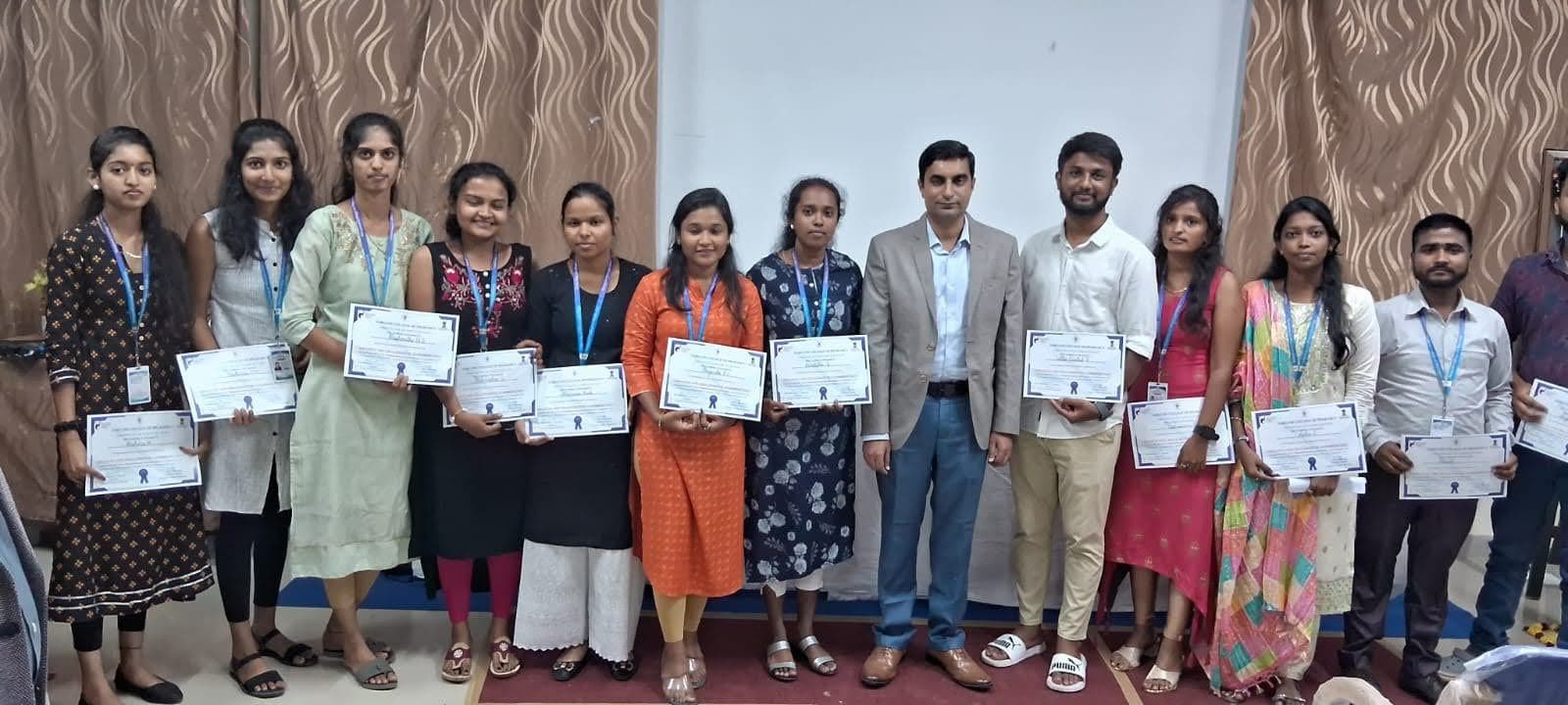 Students holding their workshop certificates