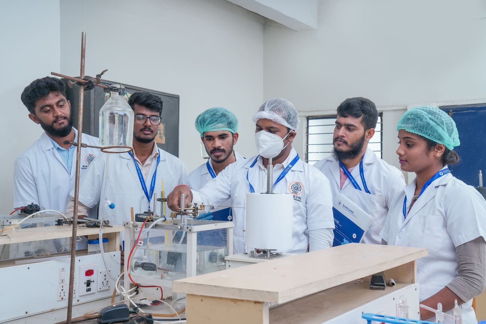 Students working on apparatus in the research lab