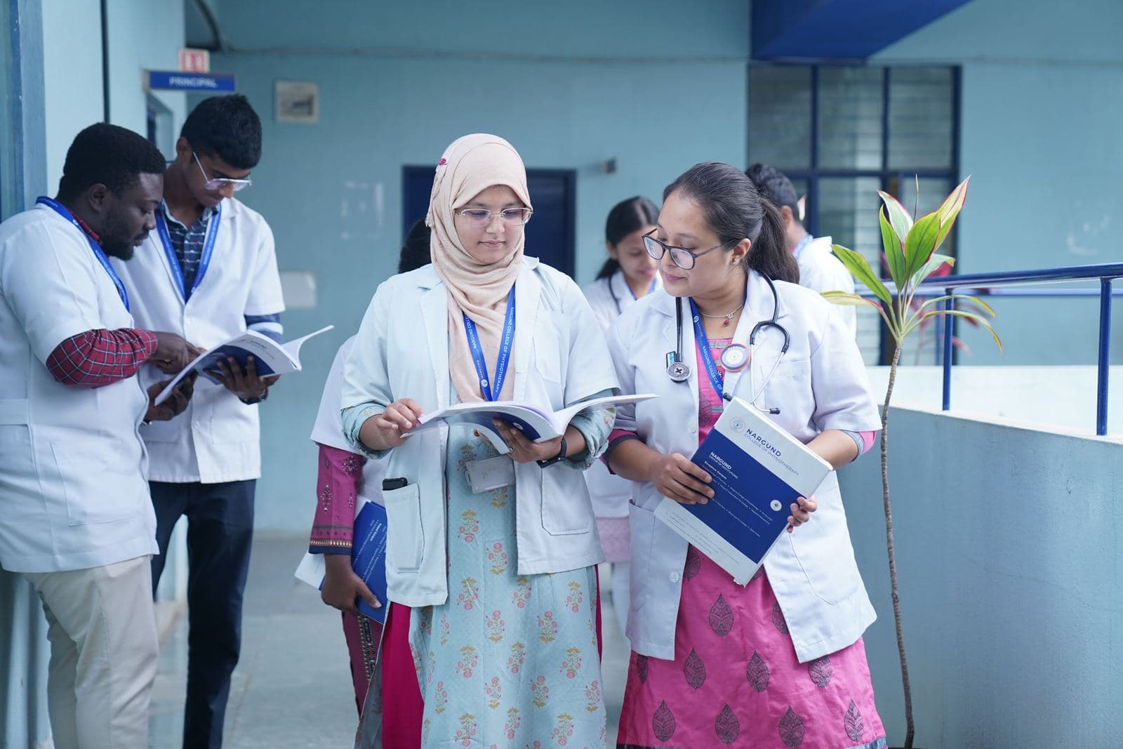 Students discussing cases with a faculty member