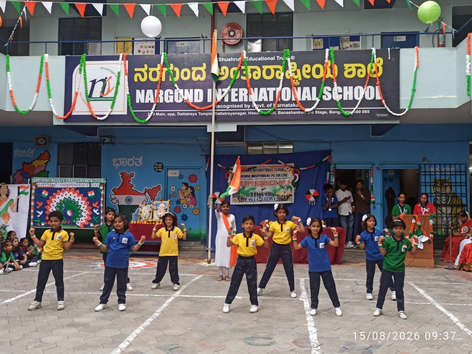 Students in house colours performing a drill