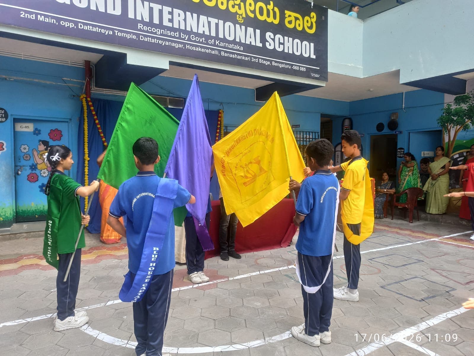 House captains carrying their house flags at the investiture ceremony