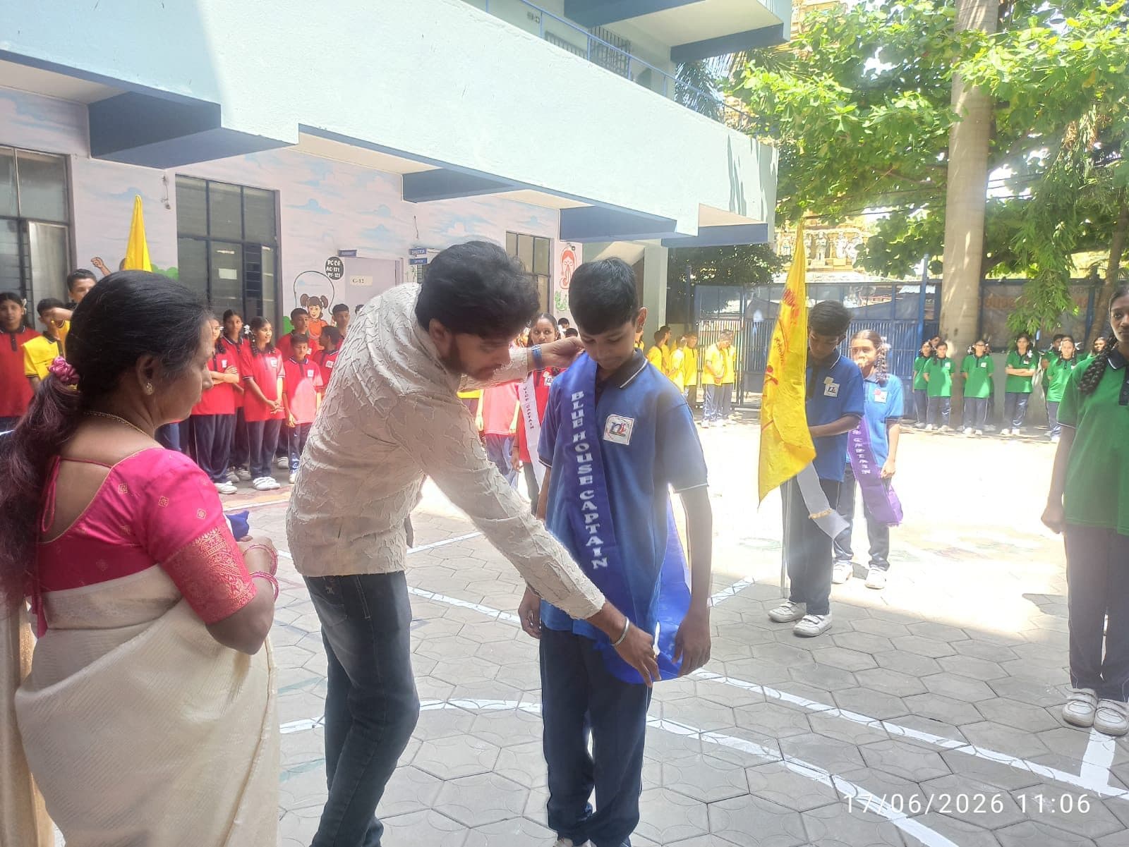 A student leader receiving a sash at the investiture ceremony